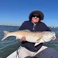 Happy client with a bull drum from Shallotte Inlet near Ocean Isle Beach NC