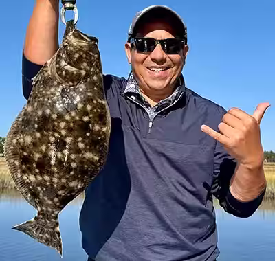 Trophy flounder caught on an Ocean Isle Beach fishing charter in the Shallotte River
