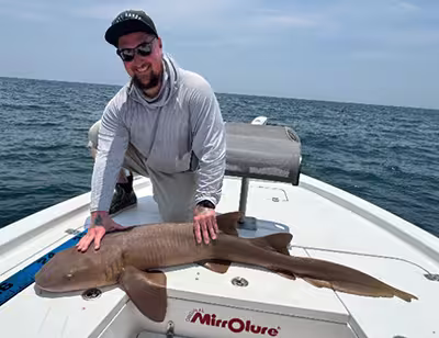 Book Salty Dawg Fishing Charters for your nearshore fishing charter and catch Nurse Sharks in OIB! Customer with a Nurse Shark caught on an OIB nearshore fishing charter
