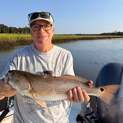 Slot redfish caught while fishing charter with Salty Dawg Fishing Charters in Ocean Isle Beach NC