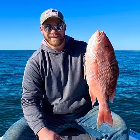 Angler holding a nice Red Snapper caught near Sunset Beach NC